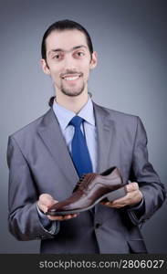 Man with a selection of shoes