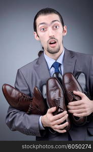 Man with a selection of shoes