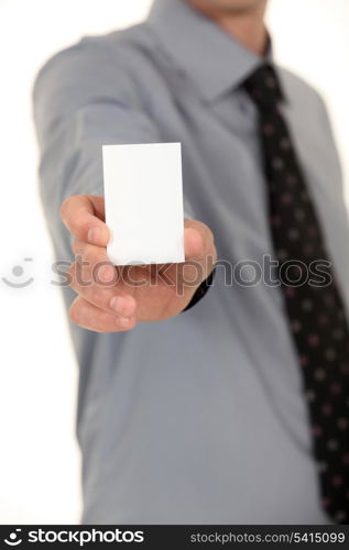 Man with a tie showing a blank card