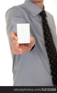 Man with a tie showing a blank card