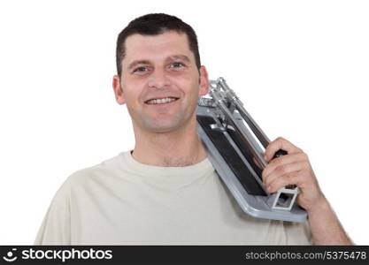 Man with a tile cutter
