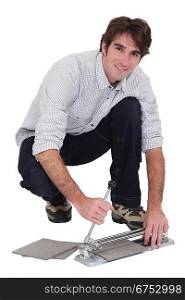 Man with a tile cutter