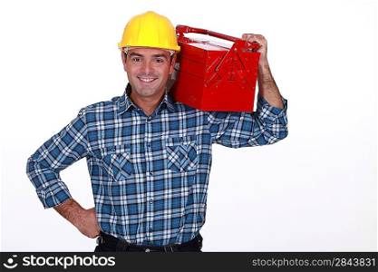 Man with a toolbox on his shoulder