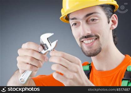 Man with a wrench in a studio