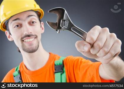 Man with a wrench in a studio