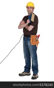 Man with an electric sander
