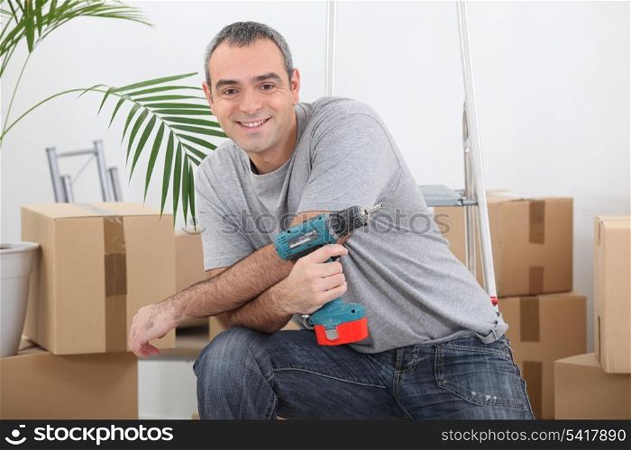 Man with an electric screwdriver