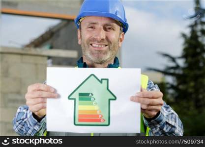 man with an energy rating paper