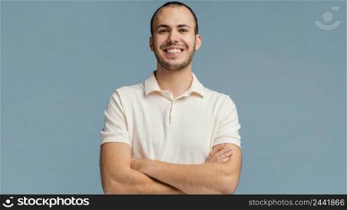 man with arms crossed laughing