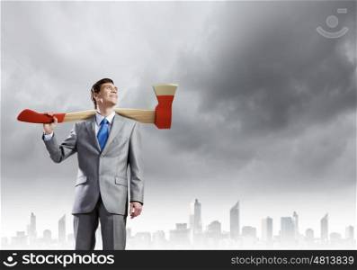 Man with axe. Young businessman holding big axe on shoulder