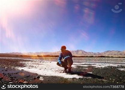 man with  backpack,  tourist,  brutal journey,  hike, the concept of active male recreation,  portrait of a severe, brutal man,  guy preparing equipment for the mountains