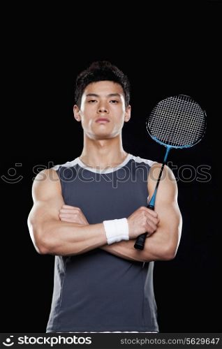 Man with badminton racket, portrait