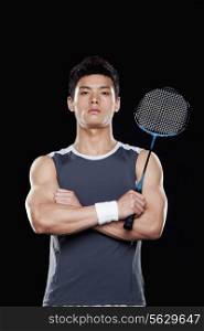 Man with badminton racket, portrait