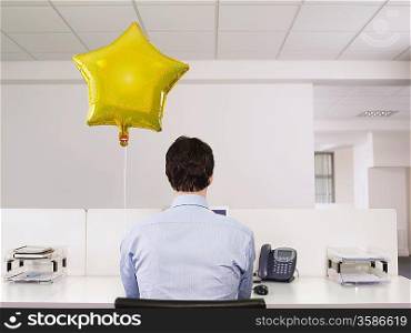 Man with Balloon at Work