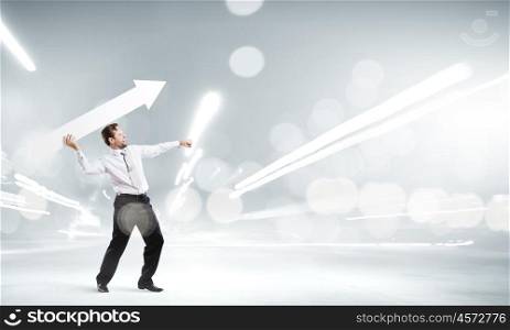Man with banner. Businessman in suit throwing white blank arrow in hands