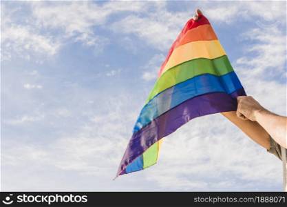 man with big flag lgbt colors blue sky . Resolution and high quality beautiful photo. man with big flag lgbt colors blue sky . High quality and resolution beautiful photo concept