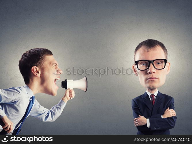 Man with big head. Funny young man with big head screaming emotionally in megaphone