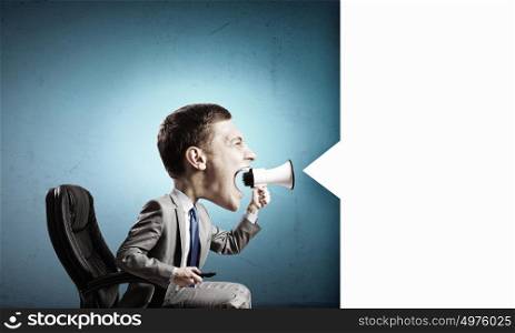 Man with big head. Funny young man with big head screaming emotionally in megaphone