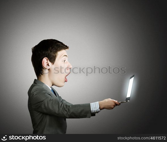 Man with big head. Young shocked man with big head looking in notepad