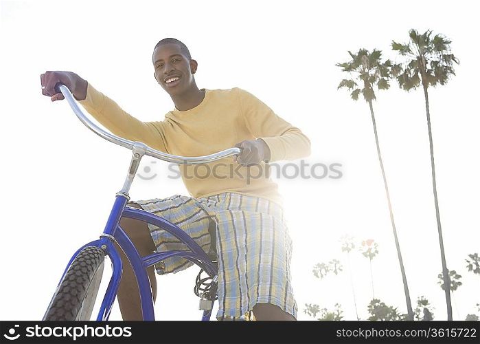 Man with bike on beach