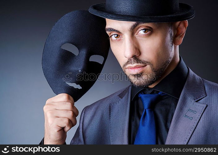 Man with black mask in studio