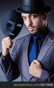 Man with black mask in studio