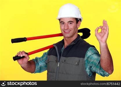 Man with bolt-cutters giving the OK sign