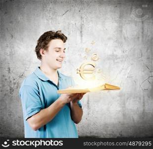 Man with book. young man in casual holding opened book with euro sign