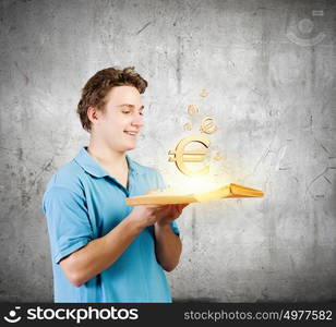 Man with book. young man in casual holding opened book with euro sign