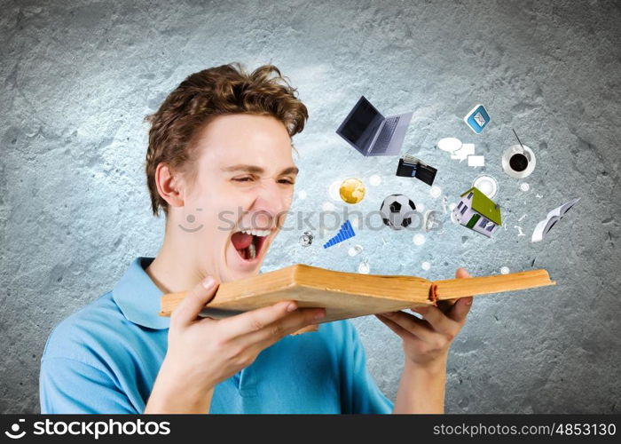 Man with book. Young man in casual holding opened book with icons flying out