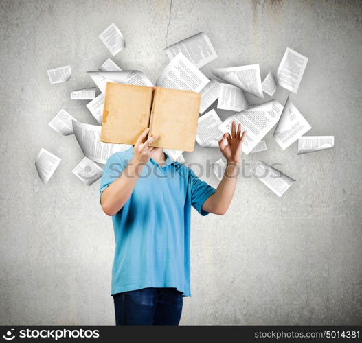 Man with book. Young man with opened book. Reading and education