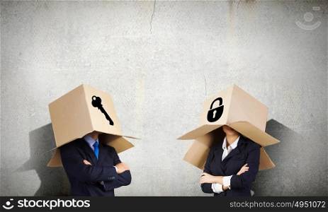 Man with box on head. Unrecognizable business people with carton boxes on head