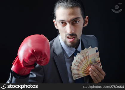 Man with boxing gloves and money