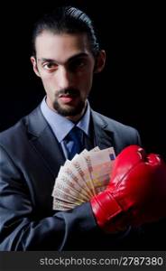 Man with boxing gloves and money
