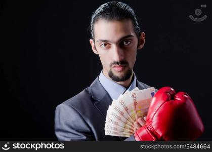 Man with boxing gloves and money