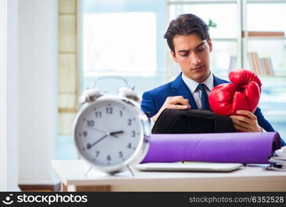Man with boxing gloves in the office
