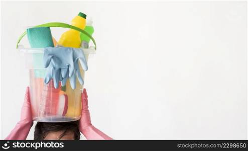 man with bucket cleaning products