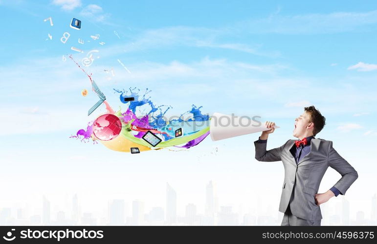 Man with bullhorn. Young businessman speaking in trumpet and colorful splashes flying out