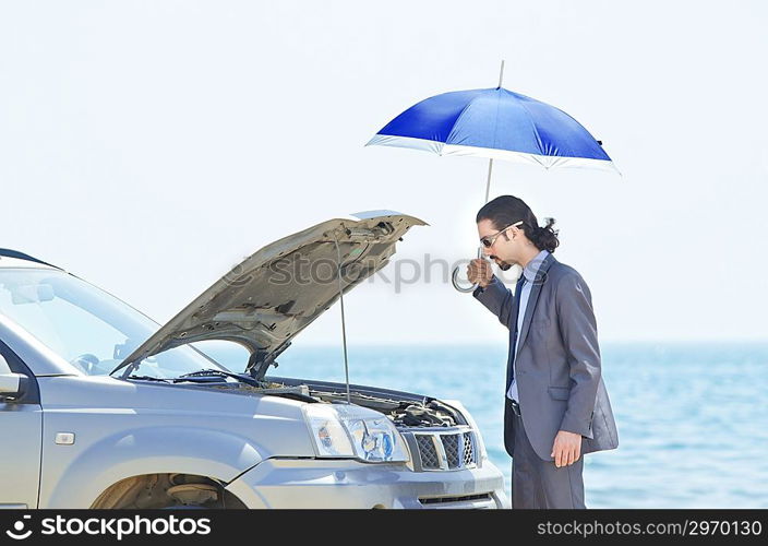 Man with car on seaside