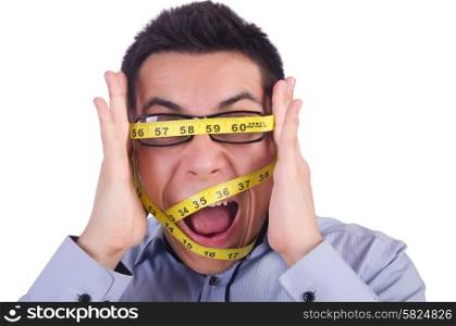 Man with centimeter in dieting concept