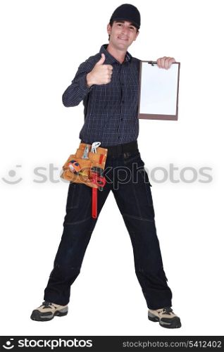 Man with clip-board giving thumbs-up