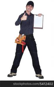 Man with clip-board giving thumbs-up