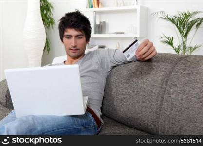 Man with credit card and computer