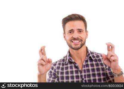 Man with crossed fingers, isolated over a white background