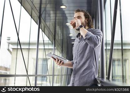 Man with digital tablet on coffee break