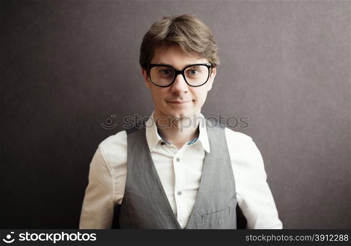 Man with eyeglasses on gray background