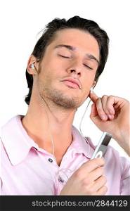 Man with eyes closed listening to music