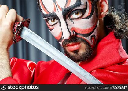 Man with face mask and sword