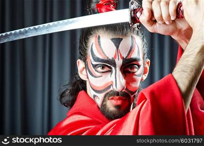 Man with face mask and sword