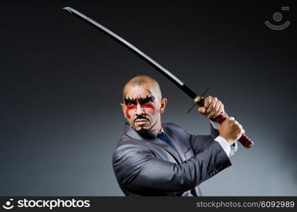 Man with face paint and sword